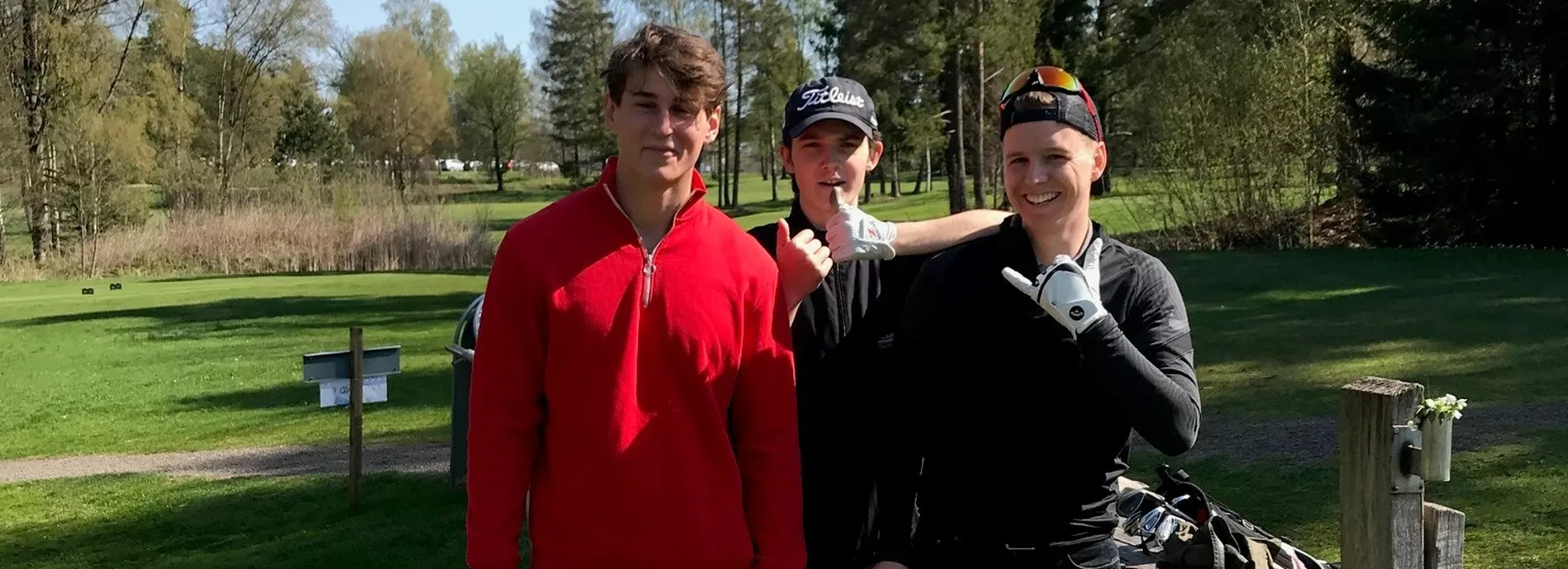 Three boys at the golf court